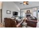 Cozy living room with high ceilings, a fireplace, and comfortable leather furniture at 16250 S 13Th St, Phoenix, AZ 85048