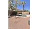 Secluded backyard with a sparkling pool, mature trees, and privacy fence, ideal for outdoor relaxation at 16559 W Lincoln St, Goodyear, AZ 85338