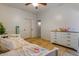 Bedroom featuring a bed, ceiling fan, and dresser on light colored tile at 16559 W Lincoln St, Goodyear, AZ 85338