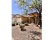 Inviting home exterior with manicured front yard and attached two-car garage at 16559 W Lincoln St, Goodyear, AZ 85338