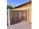 Rustic wooden gate providing privacy and security for this well-maintained residence at 16559 W Lincoln St, Goodyear, AZ 85338