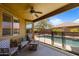 Covered patio area featuring a ceiling fan and views of the backyard pool at 16559 W Lincoln St, Goodyear, AZ 85338