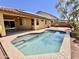 Relaxing backyard oasis featuring a sparkling pool and covered patio, perfect for outdoor entertaining at 16559 W Lincoln St, Goodyear, AZ 85338