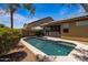 Private backyard pool and patio with covered porch offers a serene outdoor space at 16559 W Lincoln St, Goodyear, AZ 85338