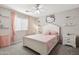 Charming bedroom featuring a cute Hello Kitty theme, lots of light, and a comfortable bed at 1718 E Harwell Rd, Phoenix, AZ 85042