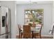 Bright dining area features a stylish table set and a window view at 1718 E Harwell Rd, Phoenix, AZ 85042