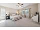 Spacious main bedroom with plush carpeting and ample natural light at 1718 E Harwell Rd, Phoenix, AZ 85042