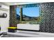 Home theater with a large screen TV and decorative wall panels at 1718 E Harwell Rd, Phoenix, AZ 85042