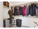 Spacious walk-in closet with organized storage solutions at 1718 E Harwell Rd, Phoenix, AZ 85042