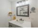 Bathroom featuring an updated vanity, modern fixtures, and a large mirror at 17441 N Del Webb Blvd, Sun City, AZ 85373