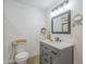 Updated bathroom featuring a modern vanity, sleek fixtures, and decorative accents at 17441 N Del Webb Blvd, Sun City, AZ 85373