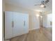 Bedroom with built in wardrobe, wood laminate floors, and overhead lighting at 17441 N Del Webb Blvd, Sun City, AZ 85373