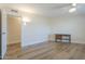 Bright bedroom features wood floors, a ceiling fan, and a cute writing desk at 17441 N Del Webb Blvd, Sun City, AZ 85373
