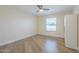 Bright bedroom showcasing neutral walls and flooring, a window, and closet at 17441 N Del Webb Blvd, Sun City, AZ 85373