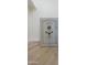 Walk-in closet features modern safe with combination lock and wood-look flooring at 17441 N Del Webb Blvd, Sun City, AZ 85373