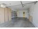 Spacious garage with storage shelves and built in cabinets at 17441 N Del Webb Blvd, Sun City, AZ 85373