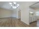 Spacious living area with wood floors, seamlessly connecting to the kitchen at 17441 N Del Webb Blvd, Sun City, AZ 85373