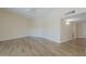 Bright living room featuring neutral walls and flooring, ceiling fan, with views to kitchen and other rooms at 17441 N Del Webb Blvd, Sun City, AZ 85373