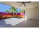 Covered patio with painted mural, ceiling fan, and epoxy flooring at 17441 N Del Webb Blvd, Sun City, AZ 85373
