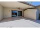 Covered patio with sliding glass door, storage shed, and epoxy flooring at 17441 N Del Webb Blvd, Sun City, AZ 85373