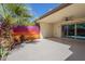 Covered patio with sliding glass door, epoxy flooring, and a desert-themed mural at 17441 N Del Webb Blvd, Sun City, AZ 85373