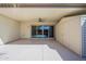 Covered patio with sliding glass door, storage shed, and epoxy flooring at 17441 N Del Webb Blvd, Sun City, AZ 85373