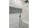 Close-up of an updated shower with mosaic tile accents and modern fixtures at 17441 N Del Webb Blvd, Sun City, AZ 85373