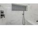 Shower area featuring mosaic tile accents and sleek, modern fixtures at 17441 N Del Webb Blvd, Sun City, AZ 85373