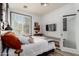 Bright bedroom with a large window, modern decor, and comfortable furnishings at 17664 W Marshall Ln, Surprise, AZ 85388