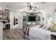 Charming bedroom boasts a built-in entertainment center and access to a private workspace at 17664 W Marshall Ln, Surprise, AZ 85388