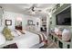 Bright bedroom featuring a built-in storage bench, dresser, and access to an en suite bathroom at 17664 W Marshall Ln, Surprise, AZ 85388