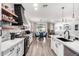 Modern kitchen with brick accents, stainless steel appliances, and a cozy breakfast nook at 17664 W Marshall Ln, Surprise, AZ 85388