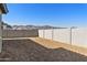 View of backyard with freshly installed desert landscaping and block fencing for privacy at 19028 W Rose Ln, Waddell, AZ 85355