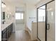 Elegant primary bathroom featuring double sinks, separate shower, and a soaking tub at 19028 W Rose Ln, Waddell, AZ 85355