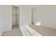 Light-filled bedroom showcases a cozy carpet, adjacent closet, and neutral walls at 19028 W Rose Ln, Waddell, AZ 85355