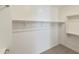 Spacious walk-in closet offering ample storage with installed shelving and rod at 19028 W Rose Ln, Waddell, AZ 85355