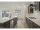 An open kitchen with a gas stove, a large island, stainless steel appliances, and plenty of counter space at 19028 W Rose Ln, Waddell, AZ 85355
