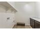 Functional laundry room featuring counter space and a utility sink, perfect for chores at 19028 W Rose Ln, Waddell, AZ 85355