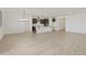 Open-concept living space showcasing sleek tile floors and a bright, airy atmosphere at 19028 W Rose Ln, Waddell, AZ 85355