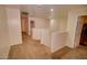 Spacious hallway with neutral walls and carpet creates a welcoming and seamless transition between rooms at 2008 N Pablo Ct, Casa Grande, AZ 85122