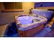 Relaxing hot tub with multicolor lighting, and a sleek cover at 2008 N Pablo Ct, Casa Grande, AZ 85122