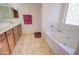 Elegant main bathroom with a soaking tub, double sinks, and updated fixtures at 2008 N Pablo Ct, Casa Grande, AZ 85122