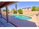 Backyard pool with basketball hoop and lush landscaping, perfect for summer fun at 2008 N Pablo Ct, Casa Grande, AZ 85122