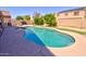 Spacious backyard featuring a pool, built-in barbeque, and well-maintained landscaping at 2008 N Pablo Ct, Casa Grande, AZ 85122