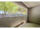 Balcony with concrete floor and partial view of parking lot at 2025 E Campbell Ave # 143, Phoenix, AZ 85016
