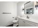 Modern bathroom with white subway tile, black hexagon floor tile and neutral color scheme at 2025 E Campbell Ave # 143, Phoenix, AZ 85016