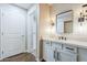 Modern bathroom vanity featuring white cabinets, tile backsplash and modern lighting at 2025 E Campbell Ave # 143, Phoenix, AZ 85016