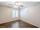Bedroom features include a ceiling fan, light, and window with shutters at 2025 E Campbell Ave # 143, Phoenix, AZ 85016