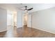 Bright bedroom with hardwood floors, ceiling fan, and ensuite bathroom at 2025 E Campbell Ave # 143, Phoenix, AZ 85016