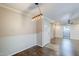 Inviting dining room area with modern lighting, wood floors, and access to the balcony at 2025 E Campbell Ave # 143, Phoenix, AZ 85016